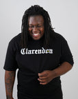 guy wearing black jamaica clarendon parish t-shirt