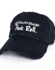 Black Signature Pork Roll Hat from the Contant Avenue collection by Wakefield District. Angled front view showing distressed details and white embroidered crossed-out Taylor Ham graphic.