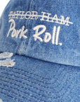 Close-up detail of the heavy white embroidery and vintage distressing on the Denim Blue Signature Pork Roll Hat by Wakefield District, Contant Avenue collection.