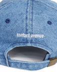 Back of blue denim cap with adjustable strap and Contant Avenue embroidery