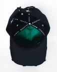 Interior view of black cap showing satin lining and inner construction