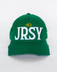 Green baseball cap with white JRSY block embroidery on front