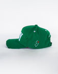 Side view of green baseball cap with embroidered NJ outline and heart detail