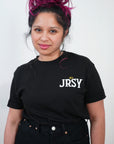 closeup of woman in black contant avenue JRSY t-shirt