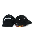 Front and back view of Wakefield District Jamaica Signature Cord Hat in black.