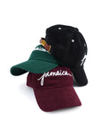 stack of Wakefield District Jamaica Signature Cord hats in black, Jasper green, and garnet red.