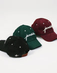 Wakefield District Jamaica corduroy hats in black, jasper green, and garnet red.