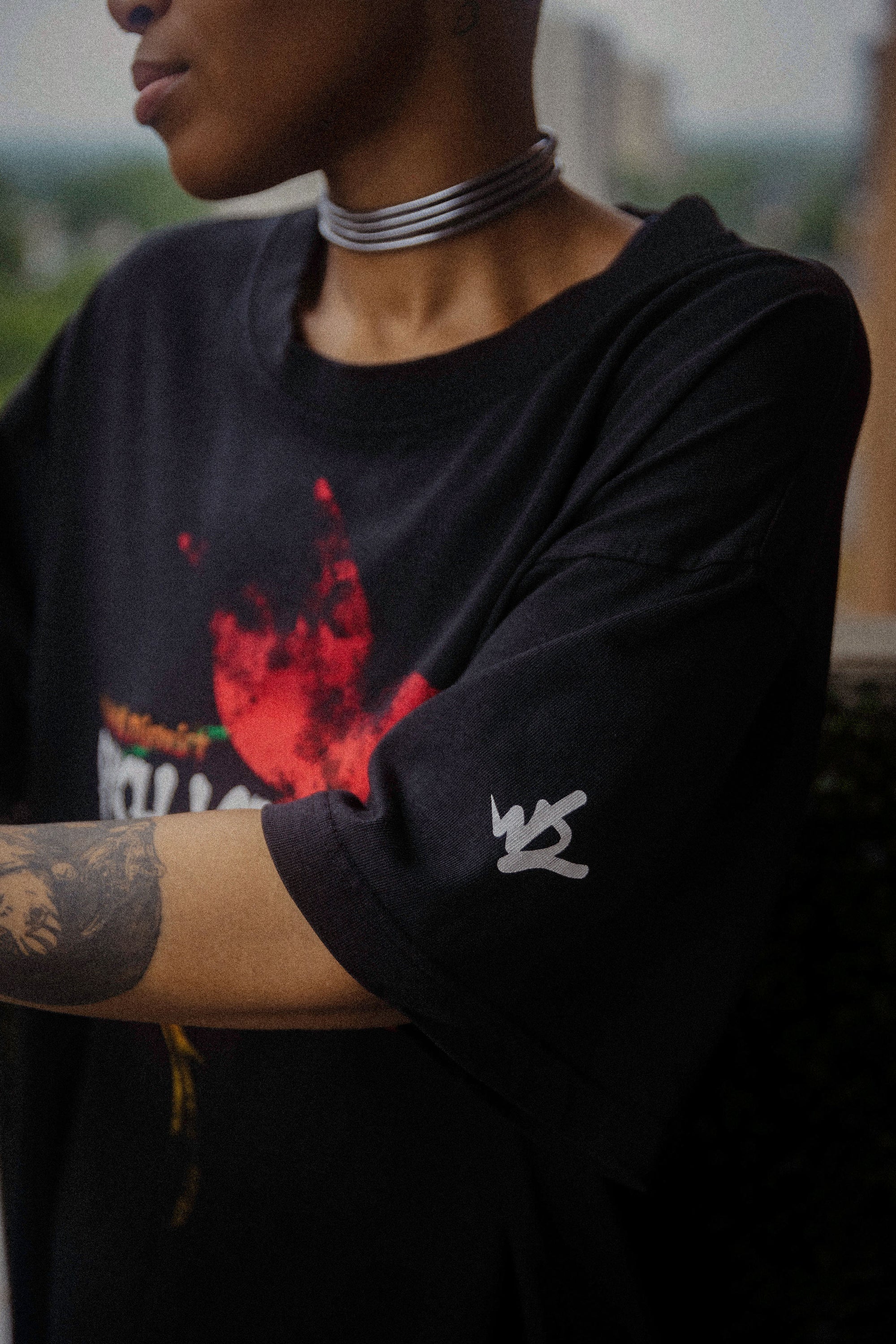 black parish love tour t-shirt sleeve logo detail on model