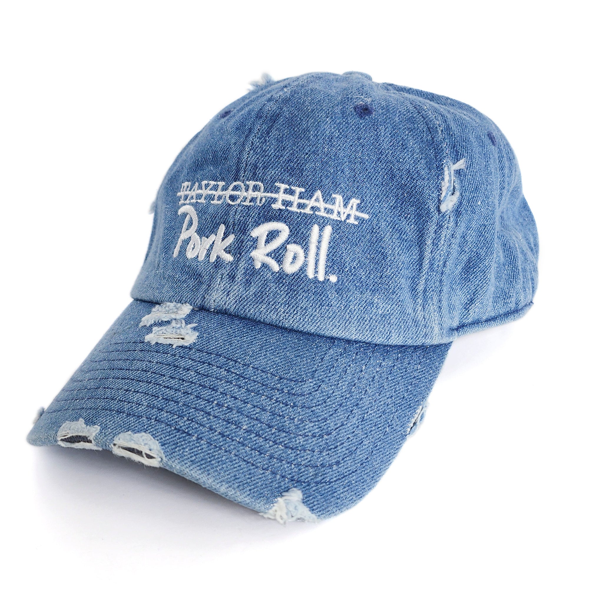 Denim Blue Signature Pork Roll Hat from the Contant Avenue collection by Wakefield District. Angled front view showing distressed details and white embroidered crossed-out Taylor Ham graphic.