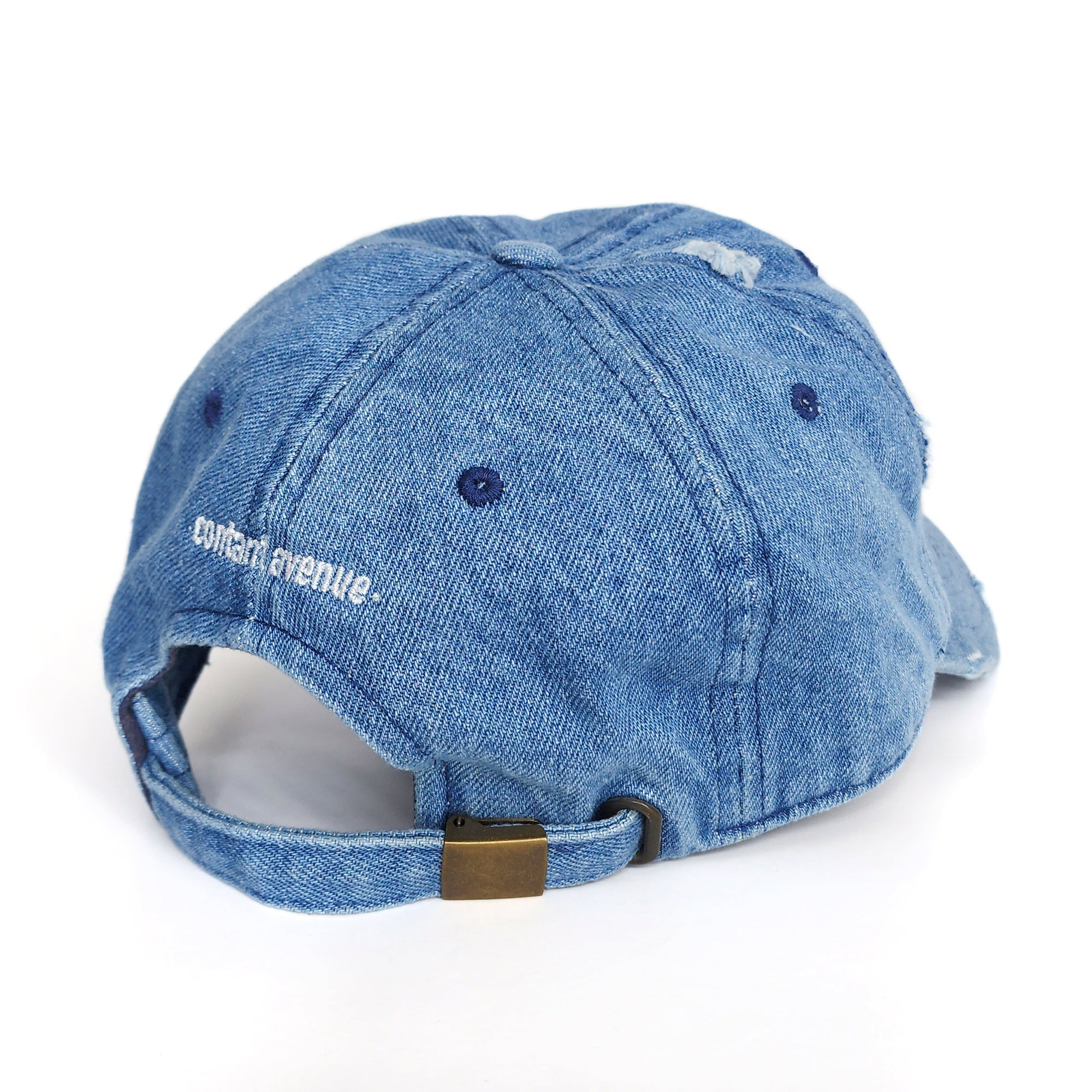 Back view of the Denim Blue Signature Pork Roll Hat showing the adjustable strap and white embroidered Contant Avenue logo. By Wakefield District.