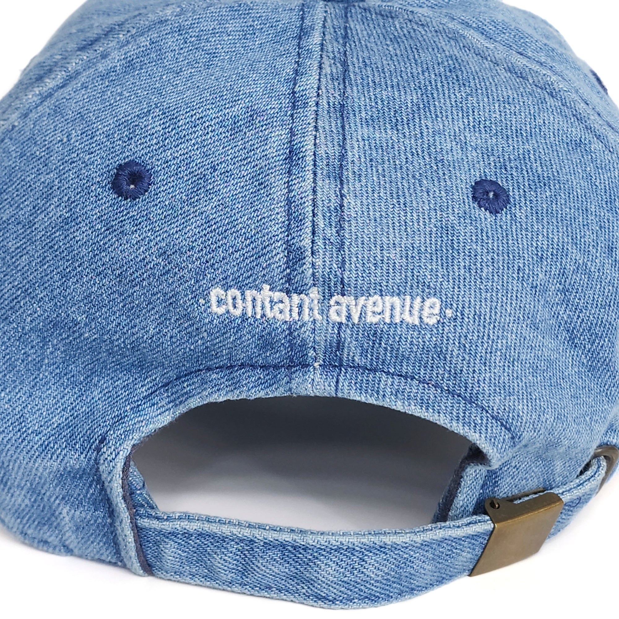 Back view of the Denim Blue Signature Taylor Ham Hat showing the adjustable strap and white embroidered Contant Avenue logo. By Wakefield District.